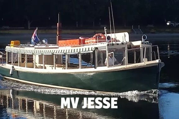 a boat is docked next to a body of water