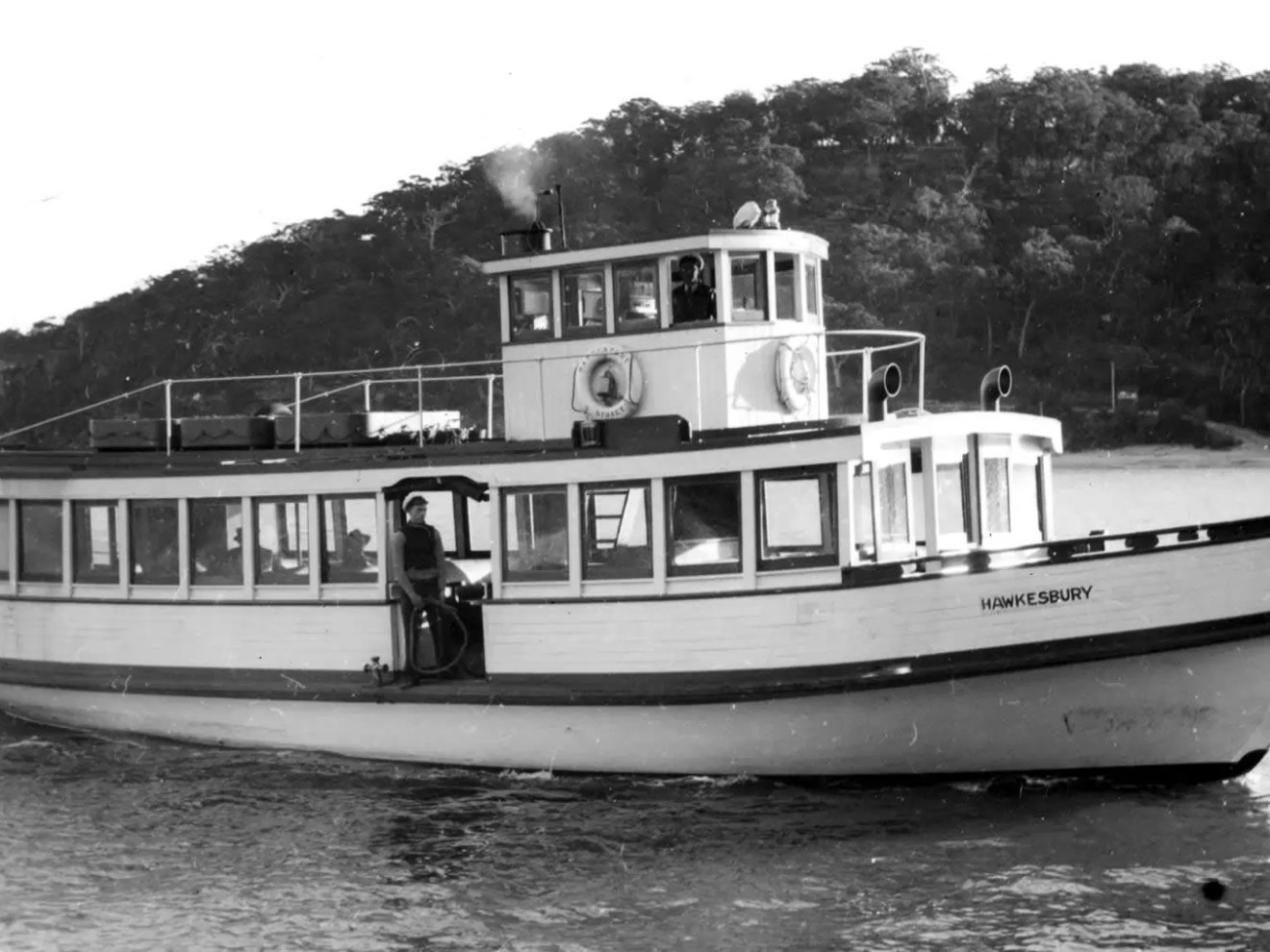 a man with a small boat in a body of water