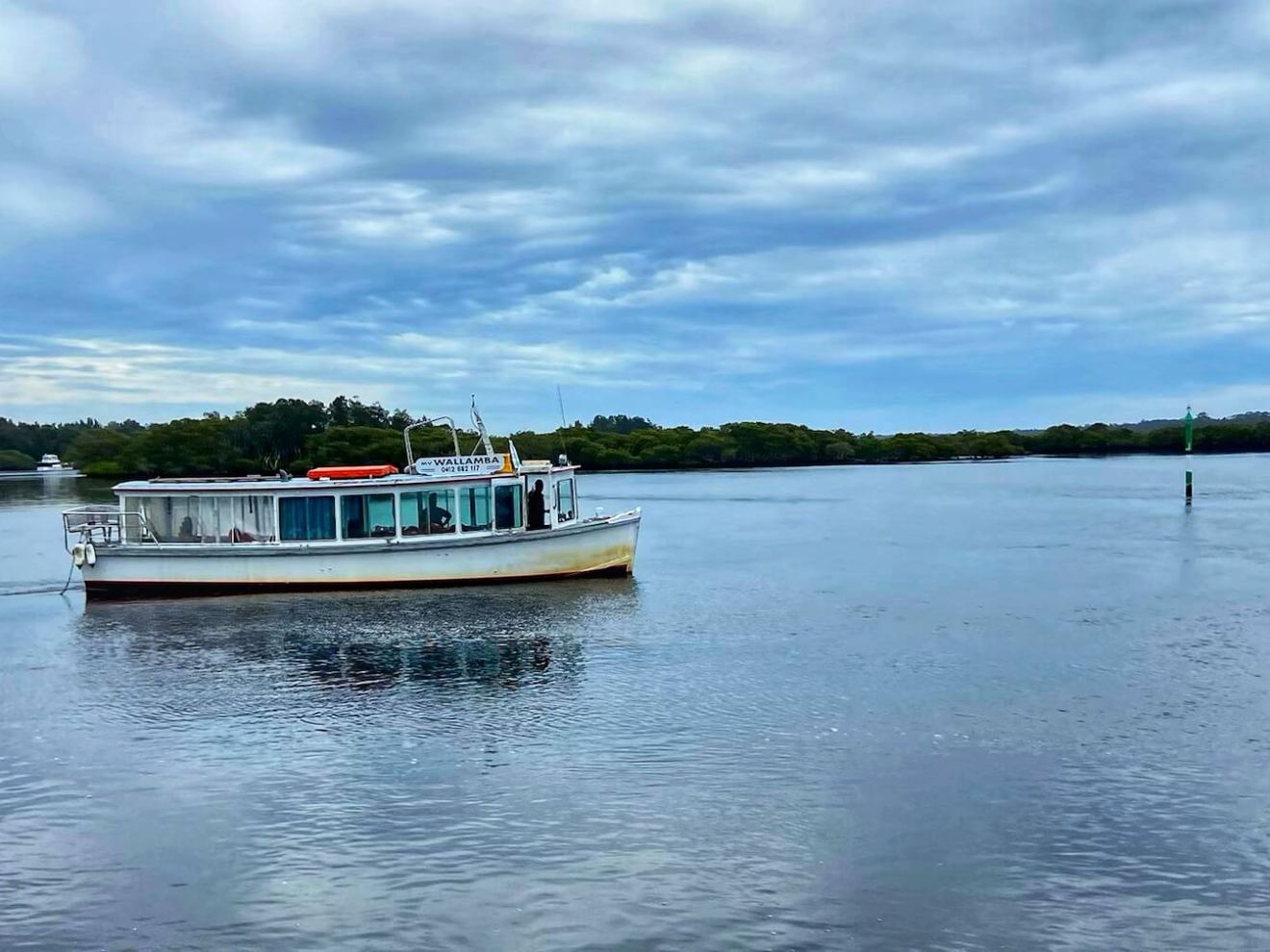 a small boat in a body of water