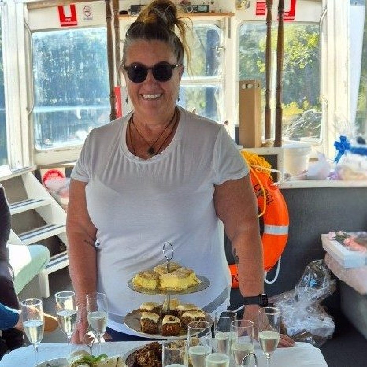a person sitting at a table with a plate of food