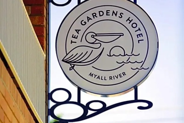 Tea Gardens Hotel sign with a pelican and Myall River text.